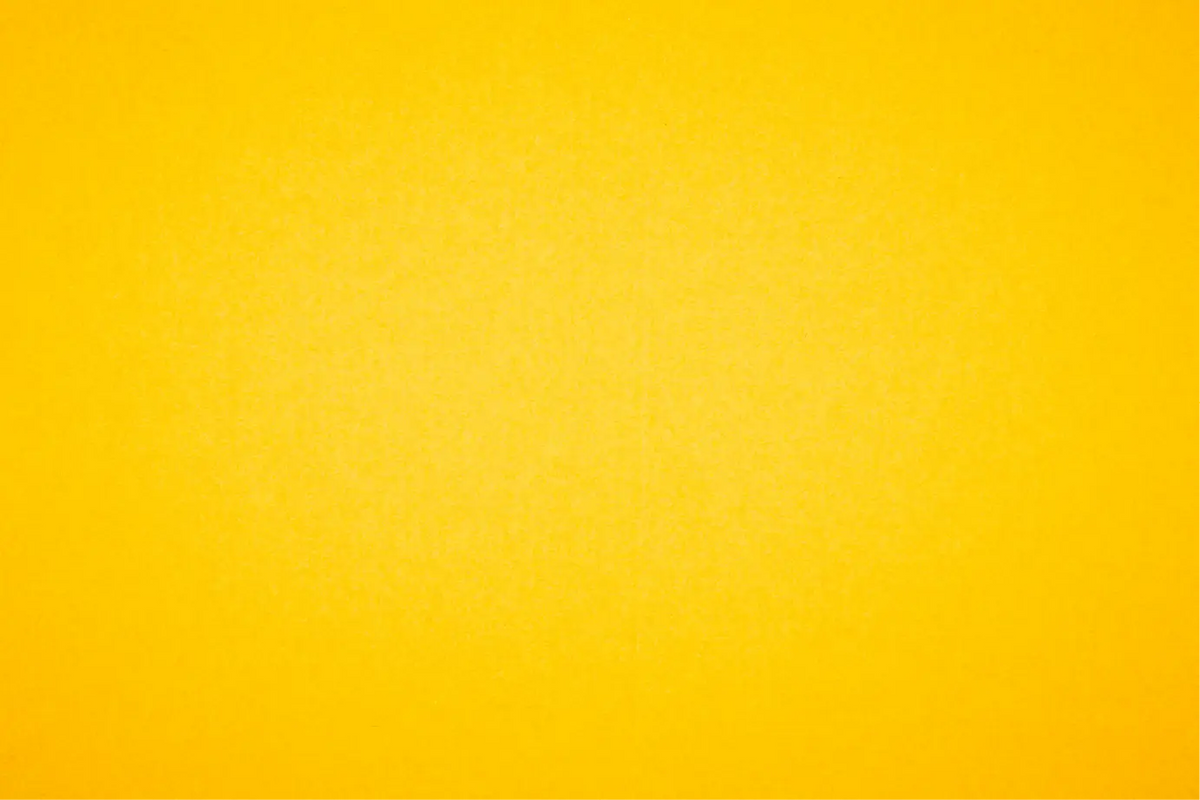 A solid bright yellow textured background with a subtle grainy or paper-like finish.