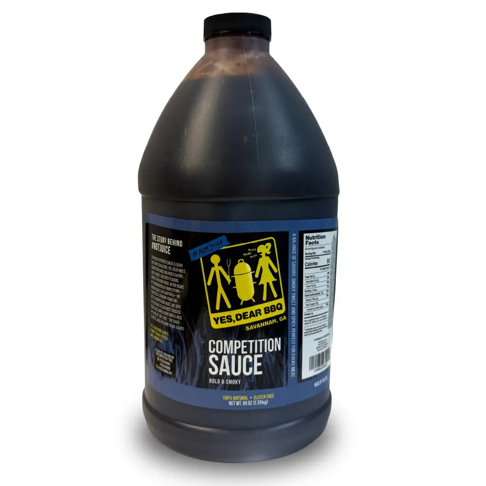 A large plastic jug of Yes, Dear BBQ Competition Sauce with a black cap and a blue and yellow label, shown on a white background.