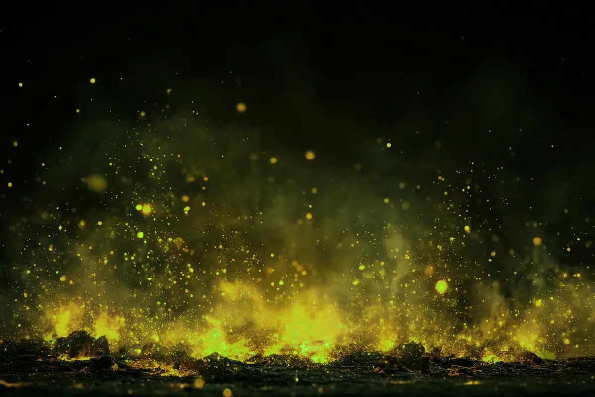 A dramatic dark scene with glowing yellow-green embers and sparks rising over a black surface, resembling a volcanic or fiery ground effect.