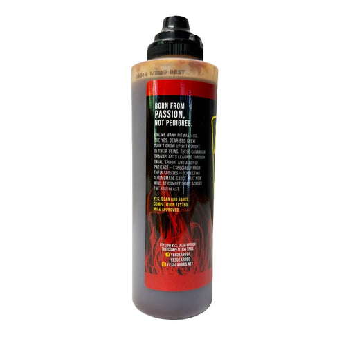 side view of red sauce bottle on white background
