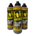 Three squeeze bottles of YES, DEAR BBQ Yellow Sauce on a white background.